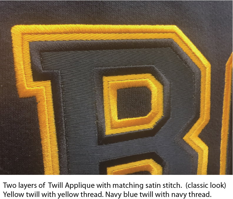Twill applique with matching satin stick where the navy blue twill matches the navy thread and yellow twill with yellow thread. 